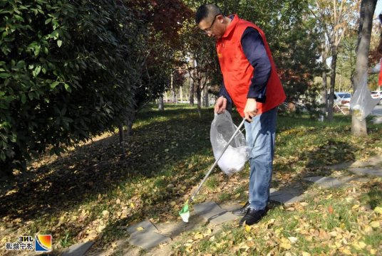 垃圾不落地   城市更美丽  营销党支部开展党员志愿服务活动